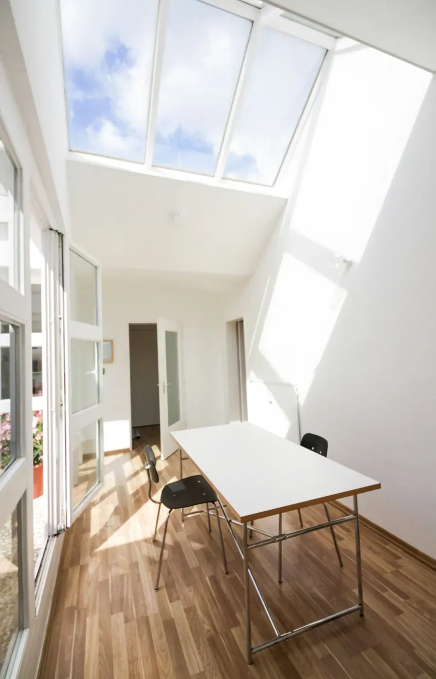 Bright room with fresh white walls and a skylight