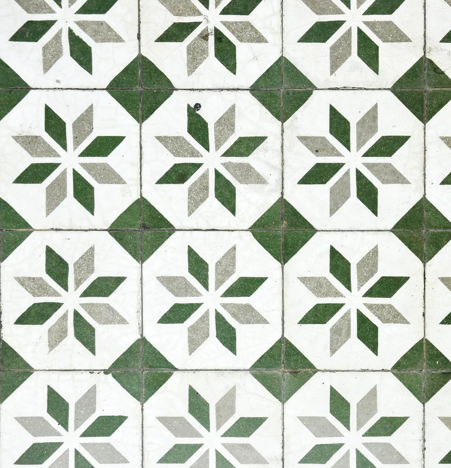 Green and white patterned floor tiles