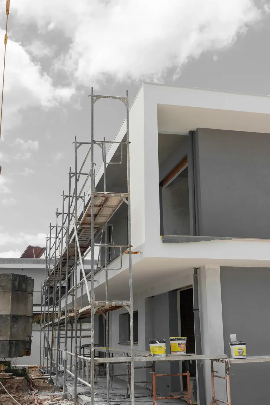 Modern villa facade with scaffolding during renovation